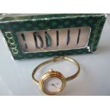 Ladies Gucci gold plated wristwatch with various coloured bezels