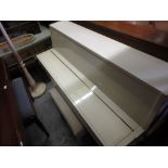 Yamaha upright piano in a cream lacquer case together with a box seat piano stool