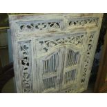 Far Eastern carved and painted wall mirror,