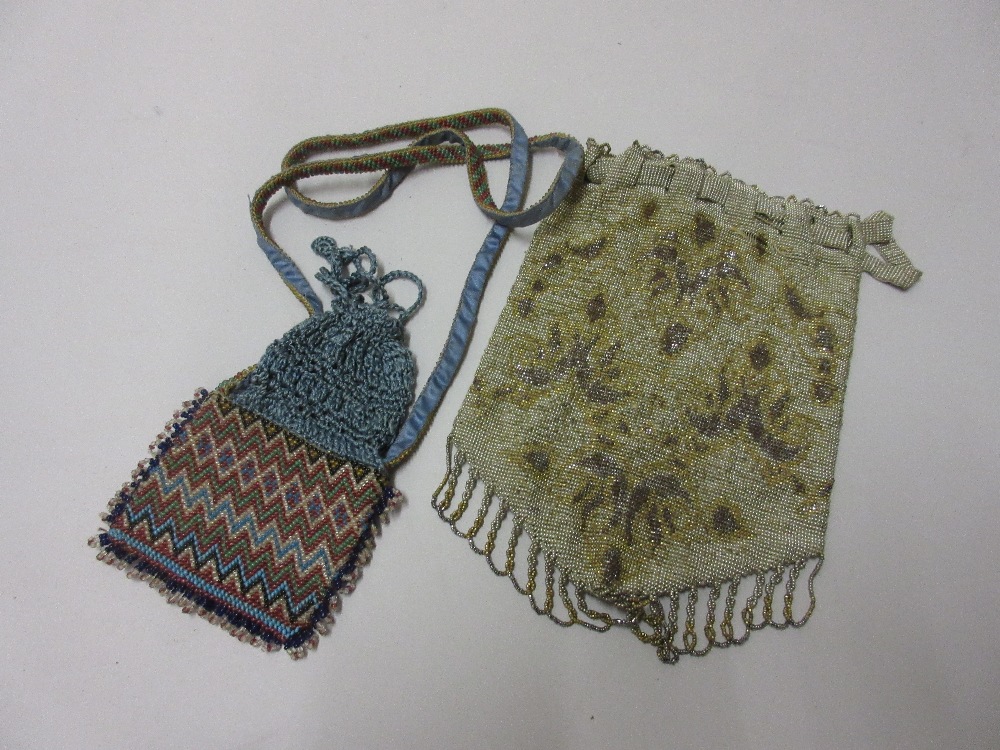 Heavy metal and beadwork floral decorated clutch bag and a smaller bead work purse with strap