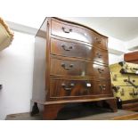 Reproduction mahogany serpentine fronted chest of four long drawers with brass swan neck handles