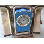 Miniature Continental 925 silver and blue enamel decorated miniature travel clock in a fitted brown