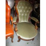 Victorian carved walnut and button upholstered open armchair on cabriole suppports