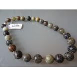 Oriental carved hardstone bead necklace with white metal clasp