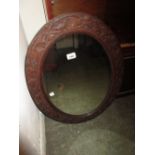 Mid 20th Century oval carved oak framed wall mirror