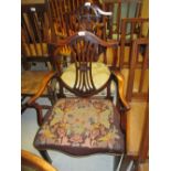 19th Century mahogany shield back open armchair with woolwork seat and square tapering supports,