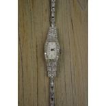 Ladies Art Deco diamond set platinum cocktail watch on a 9ct white gold bracelet strap
