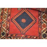 South West Persian rug with medallion design on red ground (a/f)