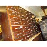 Early 20th Century industrial style mahogany bank of drawers having five rows of eight short