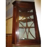 19th Century mahogany hanging corner cabinet with a single glazed door