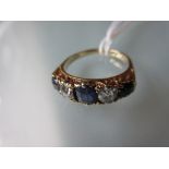 18ct Gold five stone sapphire and diamond carved half hoop ring