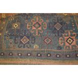 Small Belouch rug with blue ground and another similar