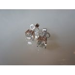 Pair of 18ct white gold diamond claw set ear studs,