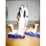 Pair of early Staffordshire figures of greyhounds, 4ins high and another early Staffordshire figure,