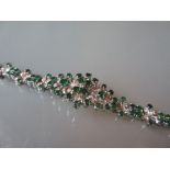 Emerald and diamond set bracelet of pierced foliate design