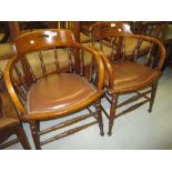 Pair of early 20th Century smokers bow armchairs with spindle turned uprights