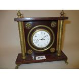 Circular brass cased sedan clock with enamel dial and Arabic numerals,