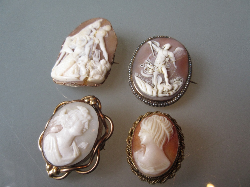 Three various carved shell cameo brooches together with another (a/f)