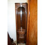 Pair of reproduction oak floor standing corner cabinets with open shelves above carved panelled