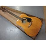 Yamaha F310 acoustic guitar fitted with electric pick-up