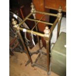 Edwardian brass and iron four division stick stand