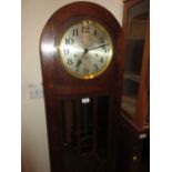 Oak longcase clock circa 1930 with dome shaped case and bun feet