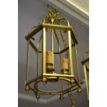 Group of three reproduction brass three light hall lanterns