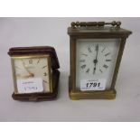 Small gilt brass cased carriage clock with enamel dial, Roman numerals and single train movement,