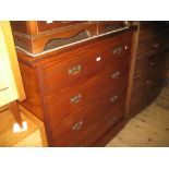 Late Victorian walnut straight front chest of four graduated drawers with brass handles