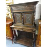 19th Century Flemish oak side cabinet with a moulded cornice above a pair of carved panelled doors,