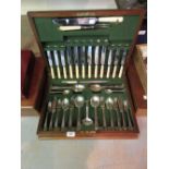 Art Deco walnut cased silver plated canteen of cutlery, silver plated bottle coaster,