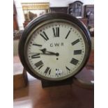 Oak and mahogany double sided station clock, the circular painted dials with Roman numerals,