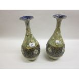Pair of Royal Doulton stoneware baluster form vases with stylised floral decoration on a mottled