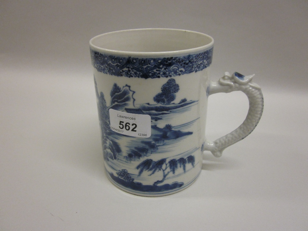 Chinese blue and white cylindrical mug with dragon form handle,