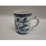 Chinese blue and white cylindrical mug with dragon form handle,
