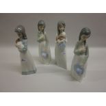 Group of four various Nao porcelain figures