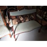 Edwardian stained beechwood drawing room sofa with a carved and pierced triple splat back and