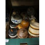 Collection of various pottery and porcelain tobacco jars,
