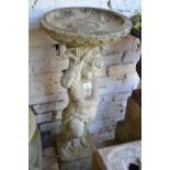 20th Century cast concrete pedestal bird bath in the form of a cherub