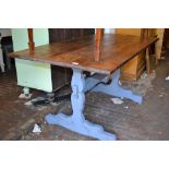 Polished pine and grey distress painted refectory style dining table on shaped end supports