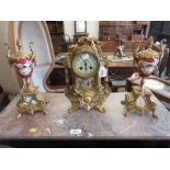 19th Century gilded spelter and porcelain mounted three piece clock set,