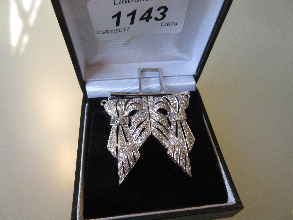 Art Deco platinum double clip brooch set with approximately one hundred and thirty round,