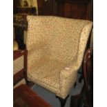 Floral upholstered barrel back wing armchair raised on acanthus carved cabriole claw and ball front