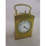 Brass cased carriage clock with dome shaped single glass case, circular enamel dial,