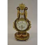19th Century French amboyna and ormolu mounted lyre form mantel clock,