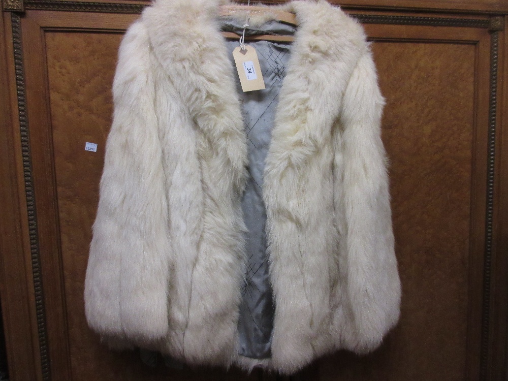 Ladies pale fur jacket with grey silk lining