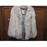 Ladies pale fur jacket with grey silk lining