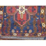 Belouch rug with a single medallion design on a blue ground with Kelim fringes