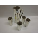 Silvered glass water jug with four beakers