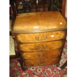 20th Century bow fronted walnut chest of four drawers with brass swan neck handles,